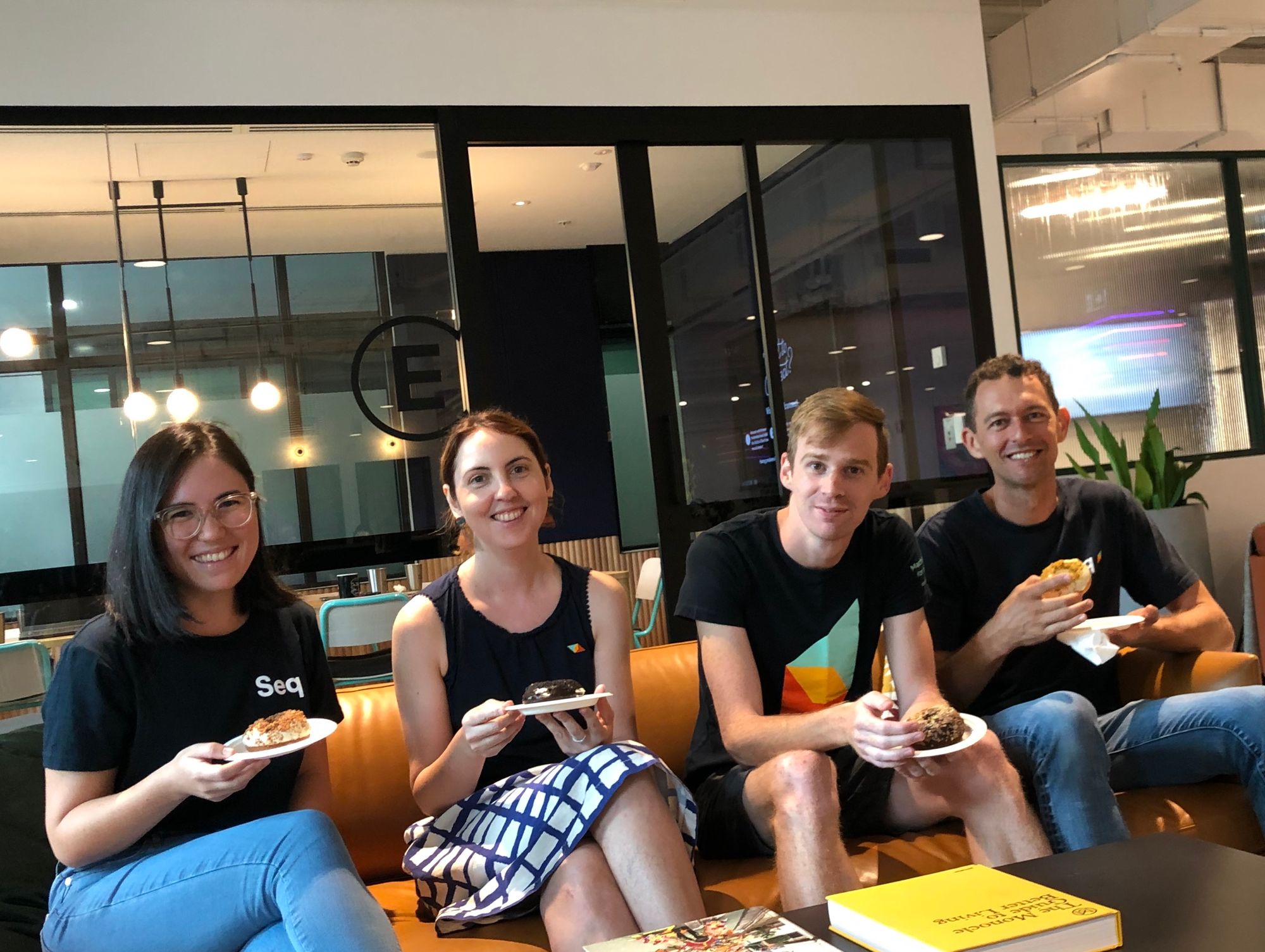 Pictured: The Datalust team -- Larene, Susan, Ashley, Nick sitting on a couch eating donuts